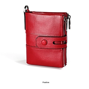 Red leather wallet detail featuring double zipper pockets and high-quality pebbled texture