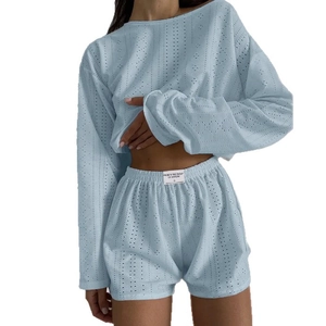 Women's light blue knit two-piece set featuring long sleeve top and shorts with texture