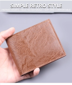 Close-up of vintage brown leather men's wallet with textured lychee grain finish