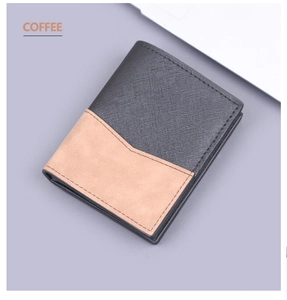 Close-up of black cross-grain leather and coffee suede patchwork on a bifold wallet