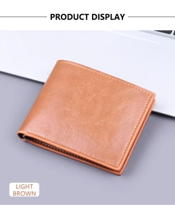 Detail of light brown men's bifold wallet with lychee grain texture and fine stitching