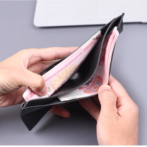 Macro view of a classic black leather wallet with double bill compartments and large capacity