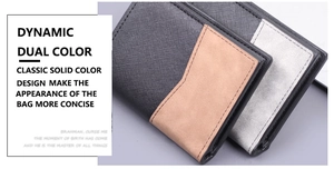 Detailed view of dual-color vertical wallets with cross-grain leather and neat stitching