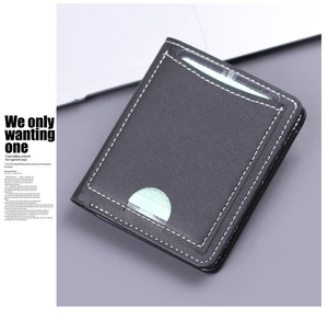 Macro shot of black leather card holder featuring white contrast stitching and card slots