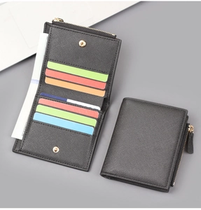 Close-up of black Saffiano bifold wallet showing colorful multi-slot card holder interior