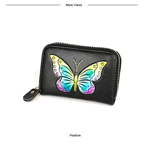 Detail of embossed gradient butterfly pattern on black leather RFID card wallet