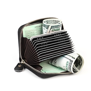 Internal accordion slots of the black pebbled leather card holder with secure metal zipper