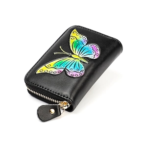 Detail of colorful butterfly relief on black leather RFID accordion card wallet with zipper