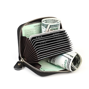 Detail view of leather accordion card holder with RFID slots and silver zipper closure