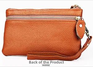 Detailed back view of brown lychee grain leather wristlet wallet with metal zipper