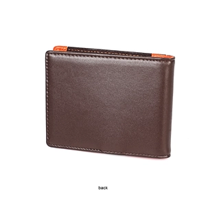 Detail view of dark brown leather wallet back with orange trim and contrast stitching