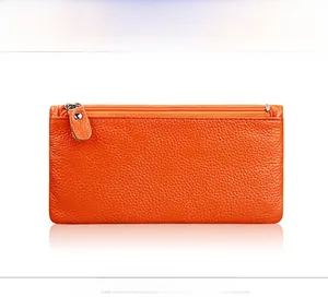 Rear view of orange pebble grain leather wallet with smooth metal zipper and stitching