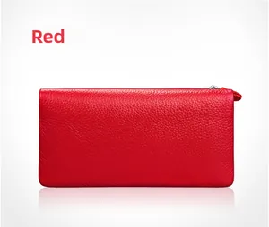 Close-up of red lychee grain leather wallet with a premium silver metal zipper detail