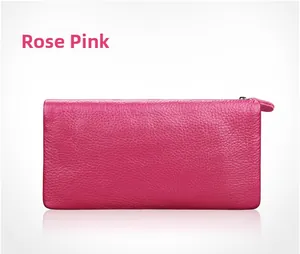 Detail of rose red long leather wallet featuring premium lychee grain and zipper closure