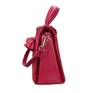 Side view of rose red leather tote bag showing lychee grain texture and gold hardware