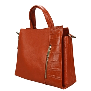 Detail view of burnt orange leather tote with litchi texture and crocodile pattern accents