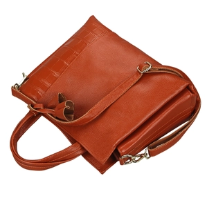 Detail of orange-brown leather handbag showing lychee and crocodile textures