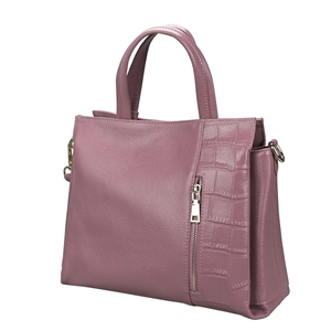 Detail of lychee and crocodile texture on elegant purple leather handbag with silver zip