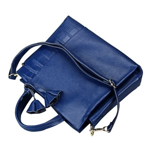 Dark blue cowhide handbag with litchi texture and golden hardware accents