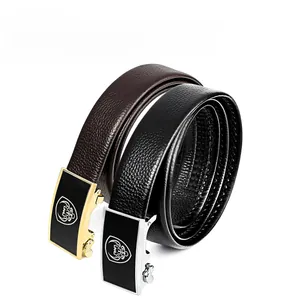 Detailed macro view of black and brown genuine leather belts with alloy automatic buckles