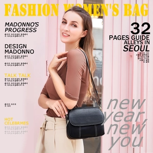 Close-up of black lychee leather bag with white contrast stitching and gold buckle detail