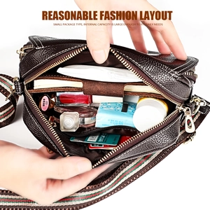 Detailed interior of dark brown pebbled leather crossbody bag with spacious compartments