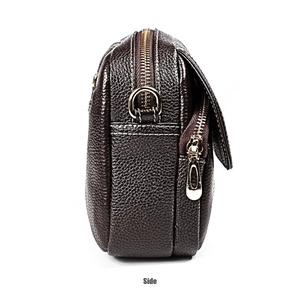 Close-up of side view showing textured brown leather and dual zipper detail on handbag