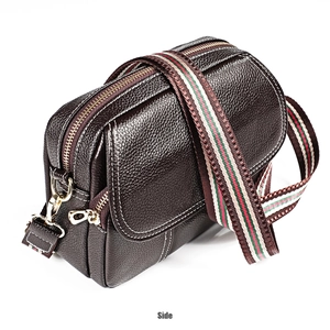 Side view of dark brown pebbled leather crossbody bag with colorful woven strap