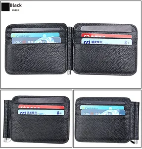 Macro shot of black pebble grain leather wallet with vertical card slots and metal money clip