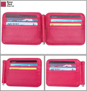 Macro detail of rose red lychee grain leather wallet with metal money clip and card slots