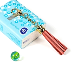 Fashionable red leather tassel keychain with gold-tone zinc alloy lobster clasp ornament