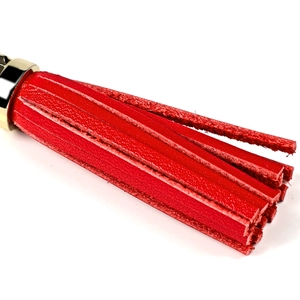 Red pebbled leather tassel keychain with polished gold lobster clasp for bags and cars