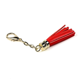 Red leather tassel keychain with gold-plated metal clasp and chain on white background