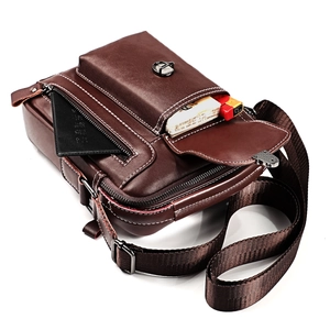 Detail view of brown leather crossbody bag with multiple pockets for daily essentials