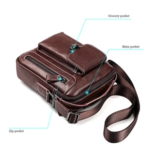 Detail view of brown leather crossbody bag showing grocery, main, and zip pockets