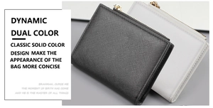 Detailed view of Saffiano leather texture and gold zipper on black and white wallets
