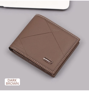 Detail of dark brown leather wallet with geometric stitching and metal decor