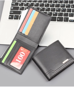 Detail view of the slim black leather wallet's interior slots and banknote section