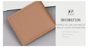 Detail view of brown leather wallet with white contrast stitching and fine texture