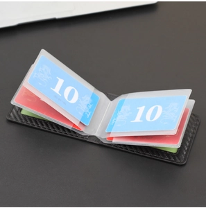 Detail of black carbon fiber wallet with multiple transparent card slots for documents