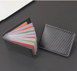 Macro detail of men's carbon fiber driver's license wallet with multi-card slot storage