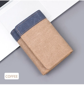 Detail of coffee brown tri-fold canvas wallet with navy flap and orange stitching