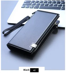 Business style black long wallet with wrist strap and silver zipper on a laptop desk