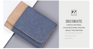 Detailed view of color blocking canvas wallet with indigo denim and khaki stitching texture