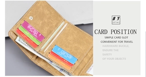 Detail view of the multi-card slots and secure metal snap closure of the tri-fold wallet