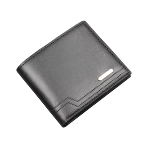 Slim men's black bifold wallet with golden metal trim and decorative perforations