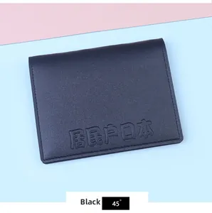 Detail view of black PU leather document cover with embossed Japanese text and card slots