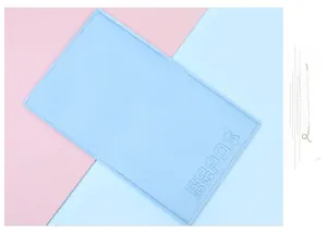 Macro shot of light blue felt document holder with embossed Chinese text and stitching
