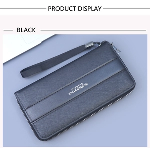 Close-up of black textured leather long wallet with zipper and detachable wrist strap