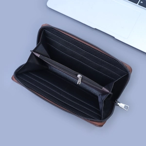 Detail view of a long leather wallet featuring 8 card slots and a central zipper coin pocket